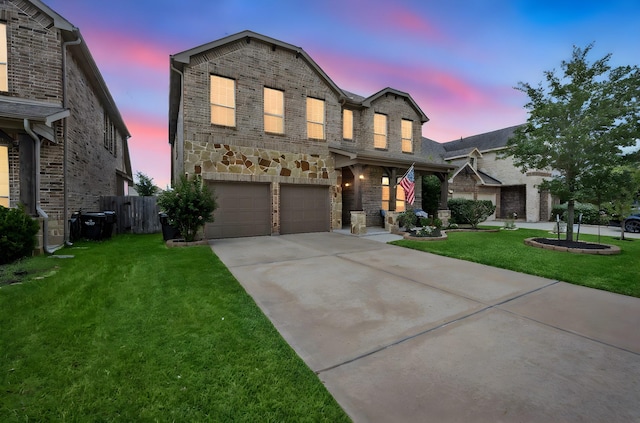 29522 Westhope Dr, Spring, TX 77386 - traditional home with concrete driveway, an attached garage, brick siding, and stone siding