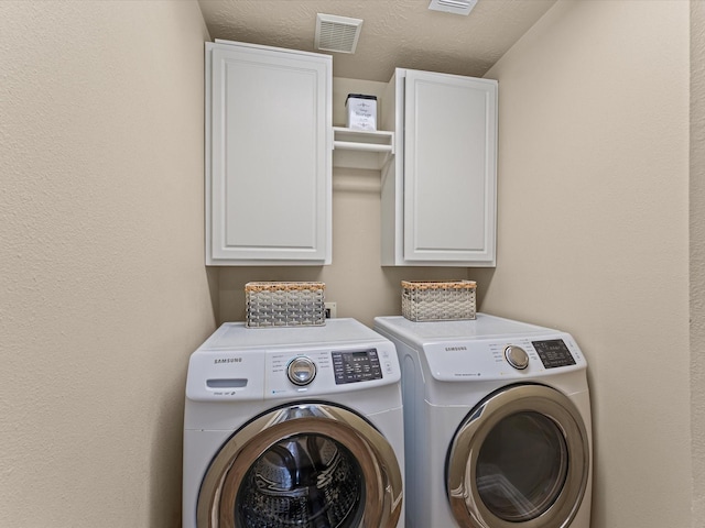 3139 Prairiestone Trail Ln, Katy, TX 77450 - laundry room featuring cabinet space and washing machine and dryer