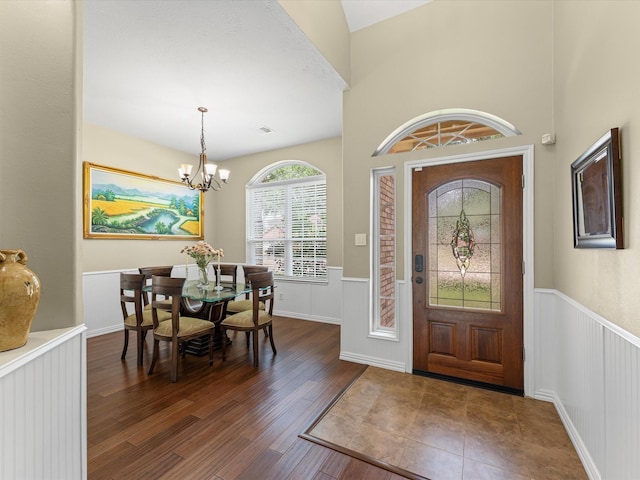 3139 Prairiestone Trail Ln, Katy, TX 77450 - foyer entrance with a wainscoted wall, wood finished floors, and a chandelier