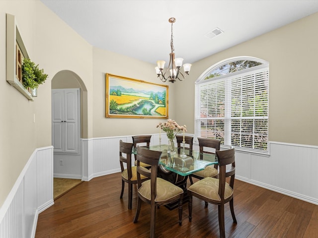 3139 Prairiestone Trail Ln, Katy, TX 77450 - dining space with hardwood / wood-style floors, wainscoting, a chandelier, and arched walkways