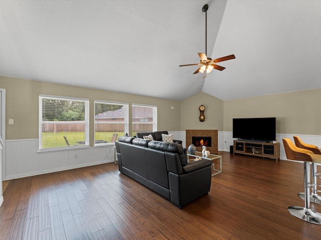 3139 Prairiestone Trail Ln, Katy, TX 77450 - living room with a wainscoted wall, a ceiling fan, dark wood-style floors, vaulted ceiling, and a fireplace