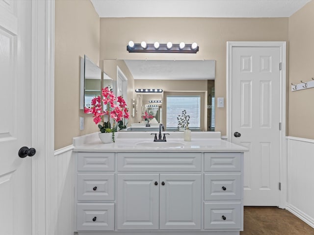 3139 Prairiestone Trail Ln, Katy, TX 77450 - bathroom featuring vanity and a wainscoted wall