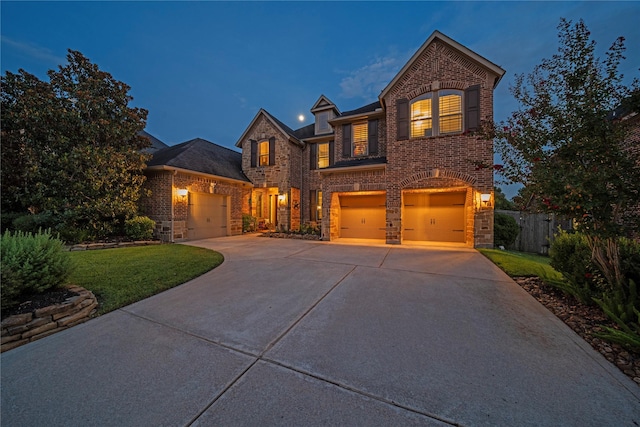 207 Fox Squirrel Ct, Pinehurst, TX 77362 - traditional home with brick siding, concrete driveway, and an attached garage