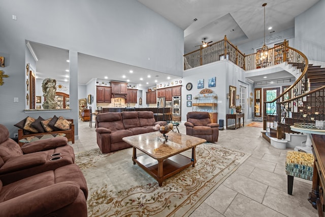 207 Fox Squirrel Ct, Pinehurst, TX 77362 - living area featuring a towering ceiling, stairs, ceiling fan, recessed lighting, and a chandelier