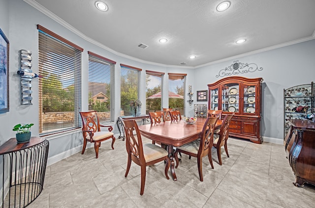 207 Fox Squirrel Ct, Pinehurst, TX 77362 - dining area with crown molding, recessed lighting, and a textured ceiling