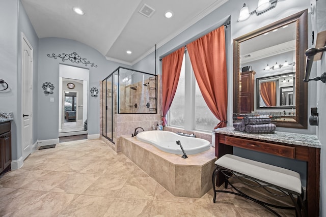 207 Fox Squirrel Ct, Pinehurst, TX 77362 - full bath with vanity, a stall shower, a bath, ornamental molding, and vaulted ceiling