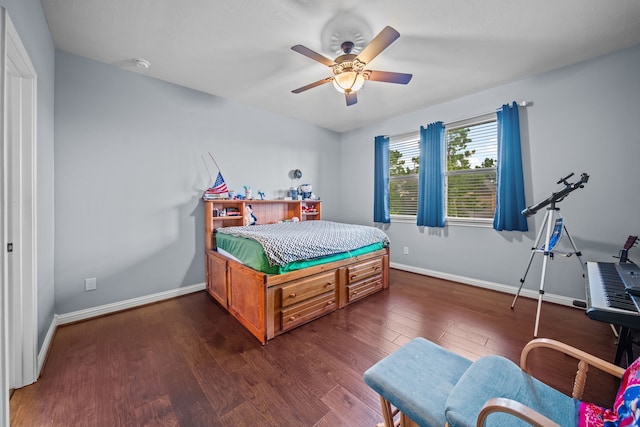 207 Fox Squirrel Ct, Pinehurst, TX 77362 - bedroom featuring dark wood-style flooring and a ceiling fan