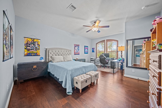 207 Fox Squirrel Ct, Pinehurst, TX 77362 - bedroom featuring a desk, dark wood-style flooring, and a ceiling fan