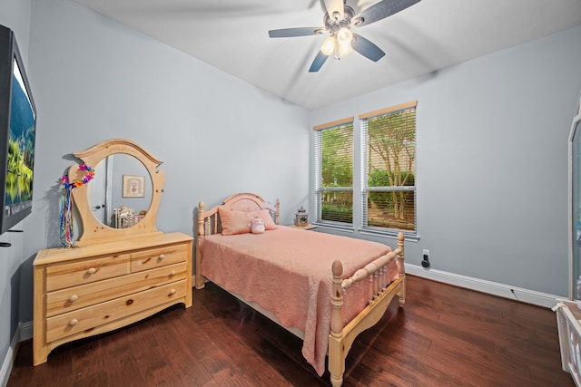 207 Fox Squirrel Ct, Pinehurst, TX 77362 - bedroom featuring dark wood-type flooring and a ceiling fan