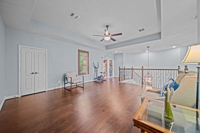 207 Fox Squirrel Ct, Pinehurst, TX 77362 - miscellaneous room featuring a raised ceiling, ceiling fan, wood finished floors, and an upstairs landing