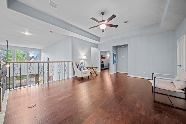 207 Fox Squirrel Ct, Pinehurst, TX 77362 - sitting room featuring a ceiling fan, wood-type flooring, and a raised ceiling