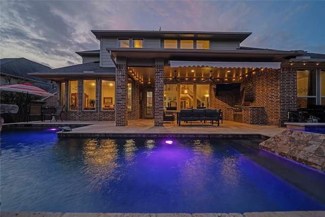 207 Fox Squirrel Ct, Pinehurst, TX 77362 - outdoor pool featuring an outdoor living space and a patio