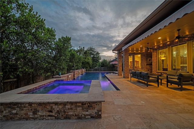 207 Fox Squirrel Ct, Pinehurst, TX 77362 - pool at dusk with an in-ground hot tub, a patio area, outdoor lounge area, and a fenced backyard