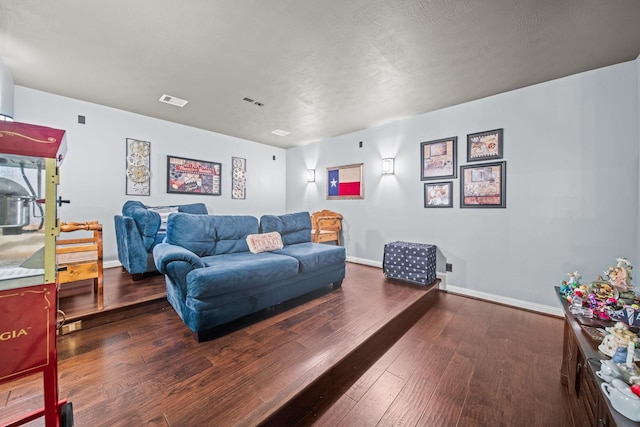 207 Fox Squirrel Ct, Pinehurst, TX 77362 - living area with hardwood / wood-style flooring and baseboards