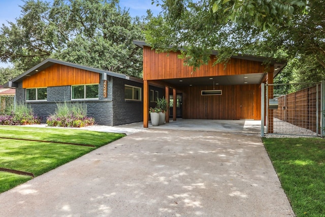 4543 Warm Springs Rd, Houston, TX 77035 - view of front of property with concrete driveway and a carport