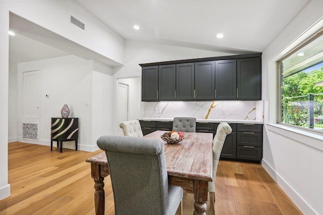 4543 Warm Springs Rd, Houston, TX 77035 - dining space with lofted ceiling, light wood finished floors, and recessed lighting