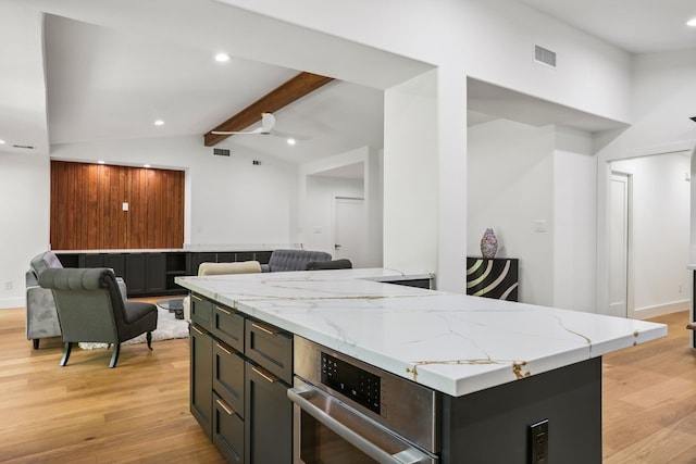 4543 Warm Springs Rd, Houston, TX 77035 - kitchen with open floor plan, light wood-style flooring, light stone countertops, and recessed lighting