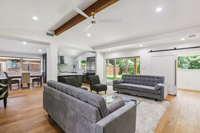 4543 Warm Springs Rd, Houston, TX 77035 - living area featuring recessed lighting, light wood-style floors, a barn door, and ceiling fan