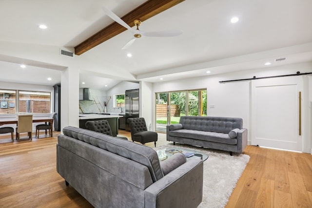 4543 Warm Springs Rd, Houston, TX 77035 - living area with recessed lighting, a barn door, light wood-type flooring, and ceiling fan
