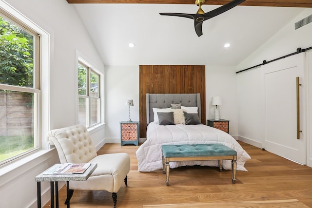 4543 Warm Springs Rd, Houston, TX 77035 - bedroom featuring lofted ceiling, a barn door, light wood finished floors, recessed lighting, and ceiling fan