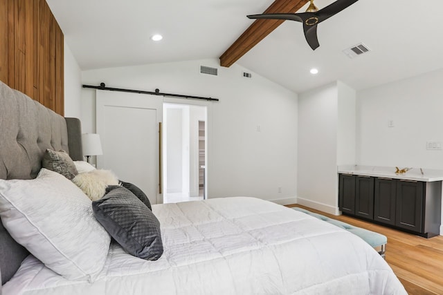 4543 Warm Springs Rd, Houston, TX 77035 - bedroom featuring light wood-style flooring, a barn door, recessed lighting, and a ceiling fan