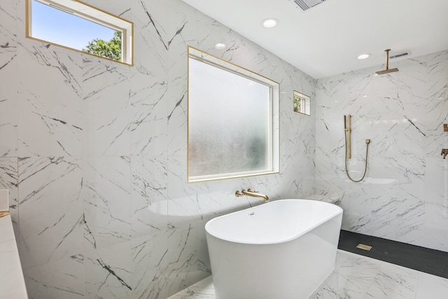 4543 Warm Springs Rd, Houston, TX 77035 - bathroom featuring a freestanding bath, stone wall, a marble finish shower, marble tiled floors, and recessed lighting