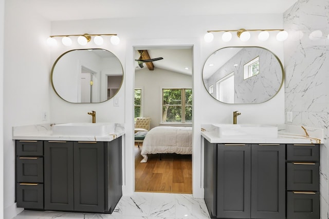 4543 Warm Springs Rd, Houston, TX 77035 - full bathroom with two vanities, marble finish flooring, and connected bathroom