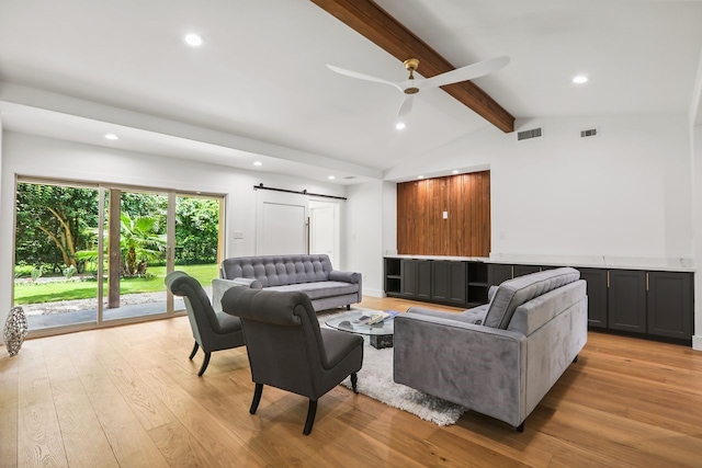 4543 Warm Springs Rd, Houston, TX 77035 - living room featuring a barn door, light wood-type flooring, recessed lighting, and a ceiling fan