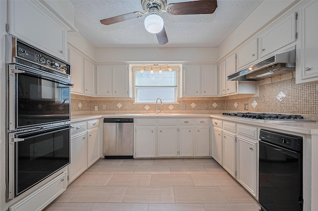 5318 Foresthaven Dr, Houston, TX 77066 - kitchen featuring appliances with stainless steel finishes, under cabinet range hood, ceiling fan, light countertops, and a textured ceiling