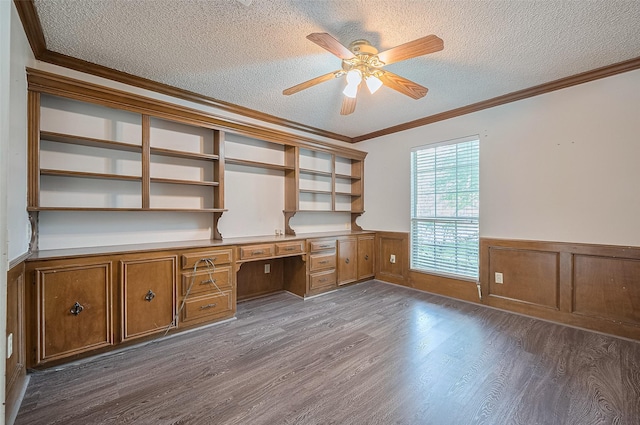 5318 Foresthaven Dr, Houston, TX 77066 - unfurnished office featuring built in study area, a textured ceiling, wood finished floors, a ceiling fan, and crown molding