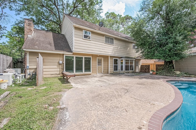 5318 Foresthaven Dr, Houston, TX 77066 - rear view of house featuring a patio area and a chimney