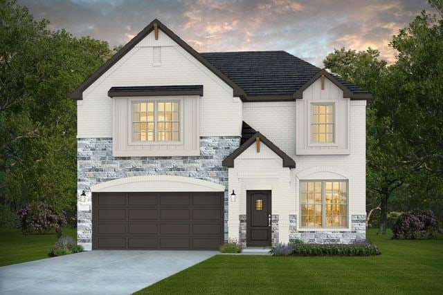 14595 Clementine Hall Dr, Conroe, TX 77378 - view of front facade with a lawn, a garage, stone siding, and concrete driveway