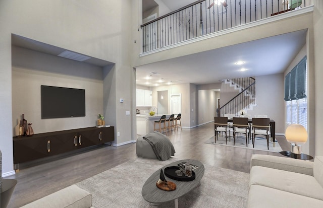 14577 Clementine Hall Dr, Conroe, TX 77378 - living room with wood finished floors, stairway, and a towering ceiling