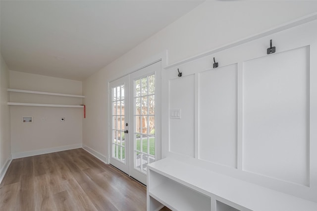 1026 W Cottage St, Houston, TX 77009 - mudroom with light wood-style floors and french doors