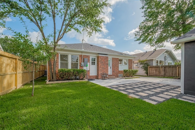 1026 W Cottage St, Houston, TX 77009 - back of property featuring brick siding and a patio area