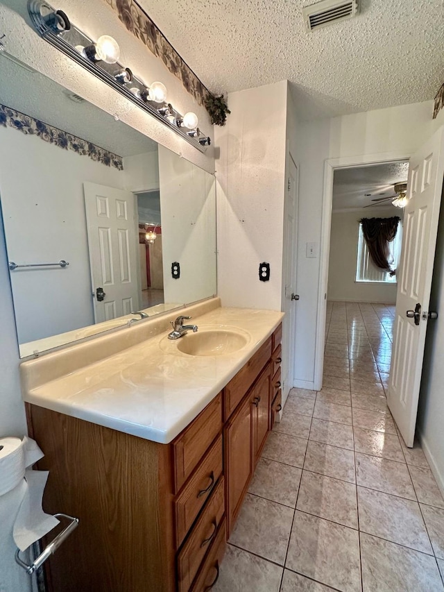 6206 Antha St, Houston, TX 77016 - bathroom featuring vanity, tile patterned floors, and a textured ceiling