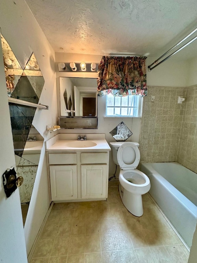 6206 Antha St, Houston, TX 77016 - bathroom featuring a textured ceiling, vanity, shower / bath combination, and tile patterned flooring