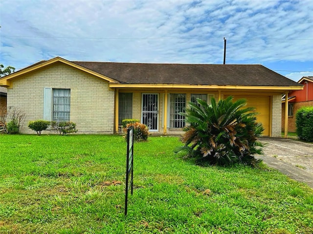 6206 Antha St, Houston, TX 77016 - ranch-style house featuring a garage, brick siding, a front yard, and driveway