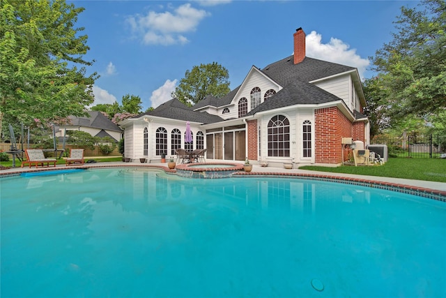 2206 Hickory Park Dr, Kingwood, TX 77345 - view of pool featuring a pool with connected hot tub, french doors, and a patio area