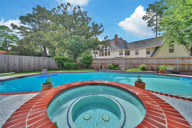 2206 Hickory Park Dr, Kingwood, TX 77345 - view of pool featuring a fenced backyard and a pool with connected hot tub