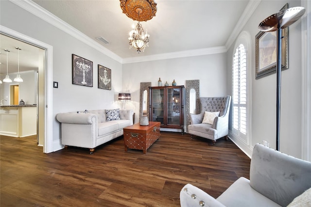 2206 Hickory Park Dr, Kingwood, TX 77345 - living room with a chandelier, ornamental molding, and dark wood-style flooring