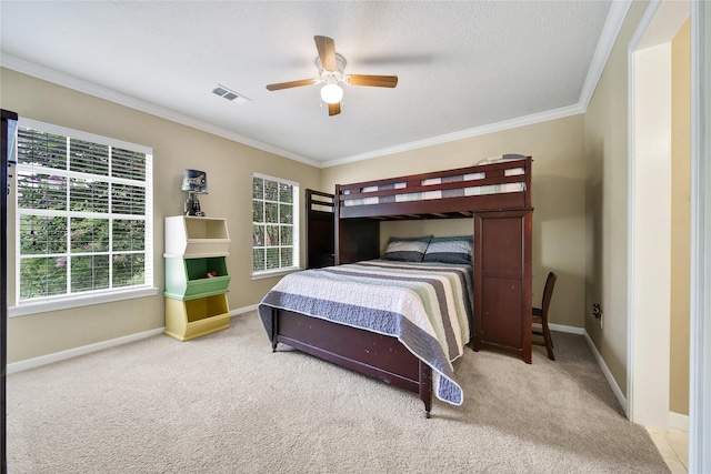 2206 Hickory Park Dr, Kingwood, TX 77345 - bedroom with ornamental molding, carpet flooring, and ceiling fan
