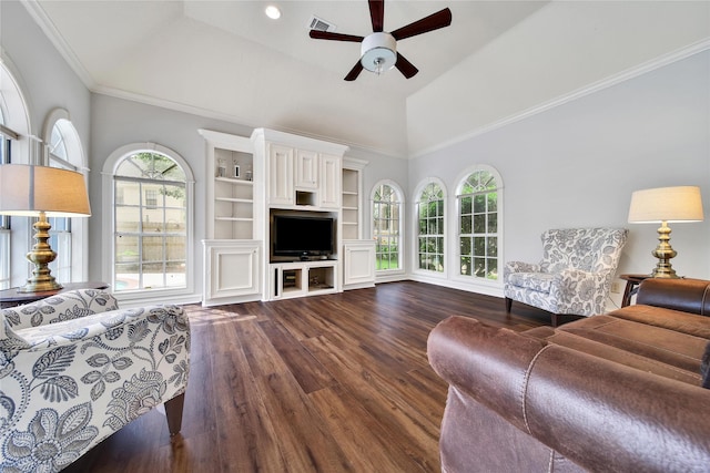 2206 Hickory Park Dr, Kingwood, TX 77345 - living area featuring ceiling fan, dark wood finished floors, high vaulted ceiling, and ornamental molding
