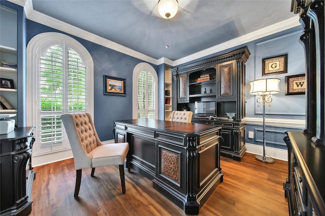 2206 Hickory Park Dr, Kingwood, TX 77345 - home office with crown molding and dark wood-type flooring