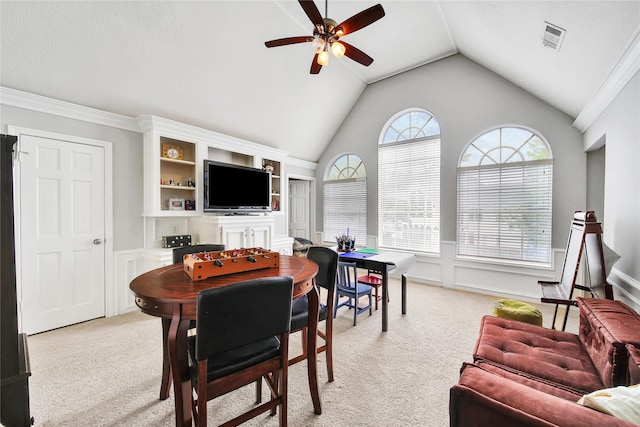 2206 Hickory Park Dr, Kingwood, TX 77345 - dining space with light carpet, ceiling fan, lofted ceiling, and wainscoting