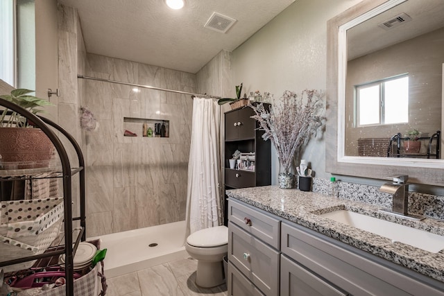 26752 Diamond Sq, Splendora, TX 77372 - full bathroom with vanity, a shower stall, marble finish flooring, and a textured ceiling