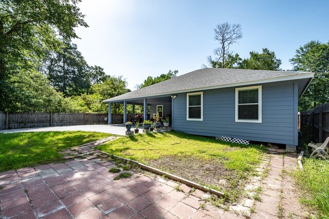 26752 Diamond Sq, Splendora, TX 77372 - rear view of house featuring a patio area, a fenced backyard, and roof with shingles