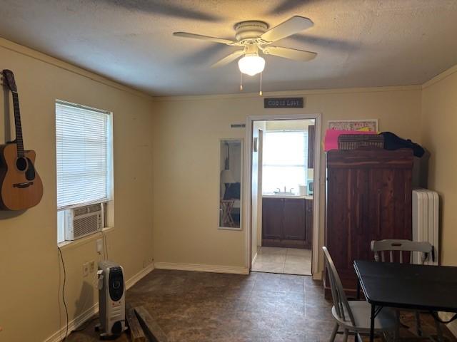 26752 Diamond Sq, Splendora, TX 77372 - entrance foyer featuring radiator, a ceiling fan, crown molding, and cooling unit