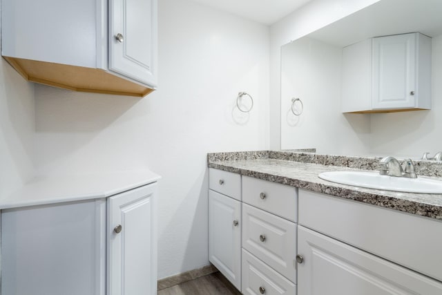 12239 Glenview Dr, Montgomery, TX 77356 - bathroom with vanity and wood finished floors