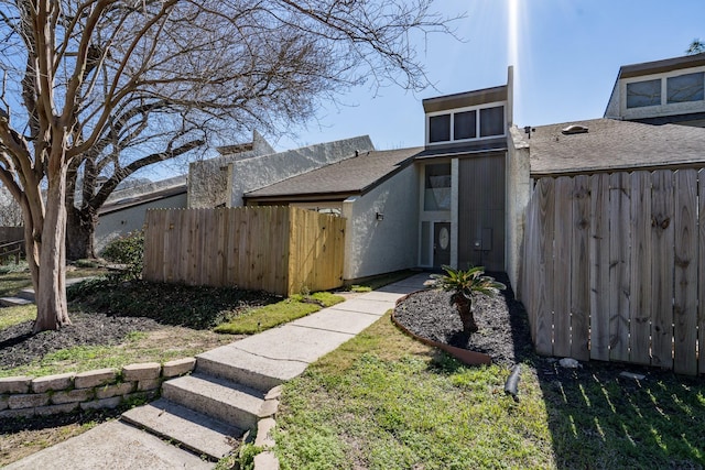 12239 Glenview Dr, Montgomery, TX 77356 - view of front facade with stucco siding and roof with shingles